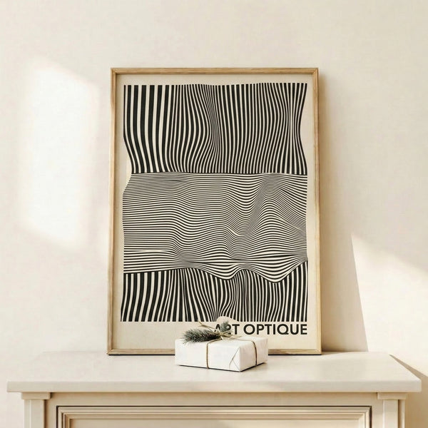 Abstract kinetic pattern with flowing geometric lines in monochrome tones displayed as a contemporary art print on a wall.
