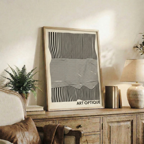 Cream, black, and white geometric abstraction forming a hypnotic linear pattern in a framed modern art print.