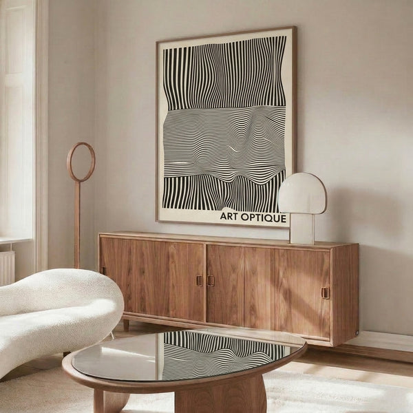Geometric abstract wall art with flowing optical patterns of black and white lines evoking movement and rhythm.