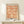 Framed wall art featuring an organic, repeating botanical pattern with Art Nouveau styling in warm terracotta and neutral tones.