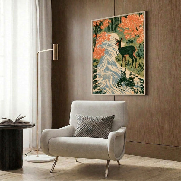 Framed nature art print in Japanese woodblock style showing a peaceful deer beside water with falling maple leaves and forest backdrop rendered in coral, slate blue, and cream.