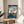 Japandi wall art in traditional woodblock style presenting an elegant autumn maple landscape with deep blue waters, teal accents, and cream-colored foliage across a contemplative mountainous scene.