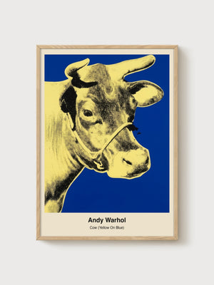 Andy Warhol Cow Yellow On Blue Poster poster in oak frame