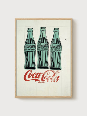 Andy Warhol Three Coke Bottles poster in oak frame