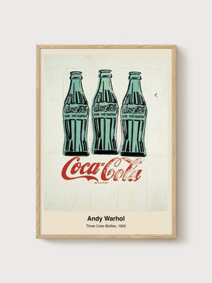 Andy Warhol Three Coke Bottles poster in oak frame