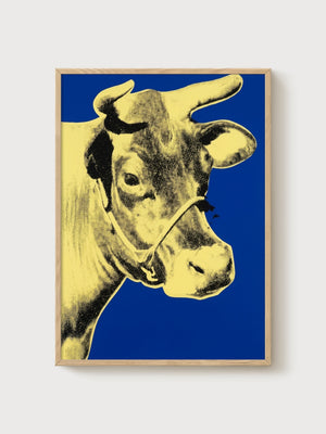 Andy Warhol Cow Yellow On Blue Poster poster in oak frame