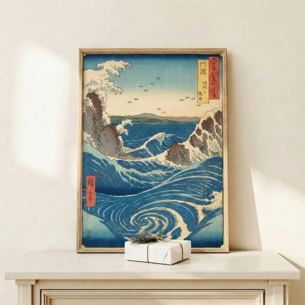 Serene yet powerful Japanese woodblock seascape with swirling whirlpool rendered in prussian blue, cream, and turquoise; rocky formations and distant peaks in brown and pale yellow tones.