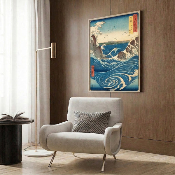 Traditional woodblock ocean print with dramatic Naruto whirlpool rendered in layered blues and creams, turquoise accents, brown coastline details, and pale yellow sky evoking serene majesty.