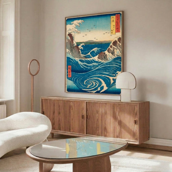 Japanese woodblock art depicting powerful whirlpool in prussian blue waves with turquoise swirls, cream foam, brown rocky shore, distant peaks, and flying birds in vintage aesthetic style.