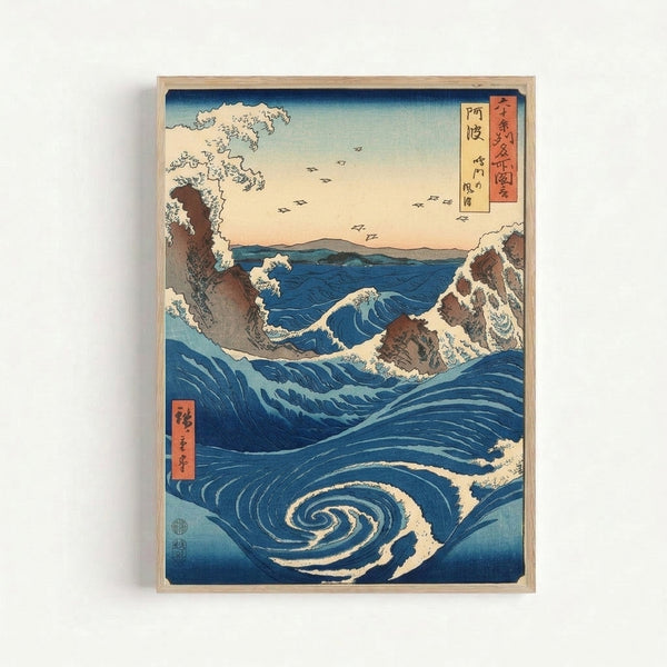 Vintage-style art print showing a powerful ocean whirlpool in indigo and blue, with rugged coastal cliffs and flying birds beneath a serene sky, mounted on a wall.