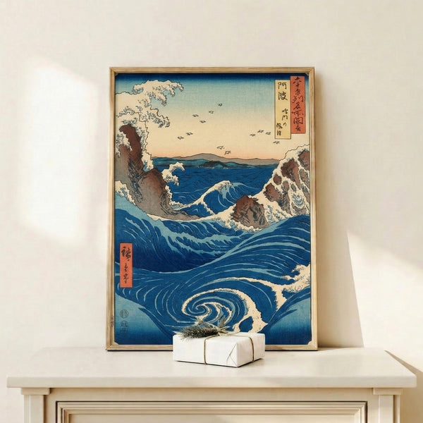 Framed poster of a swirling whirlpool scene in deep blue and indigo, capturing an awe-struck moment of nature with cliffs, birds, and soft sky in the traditional Japanese style.