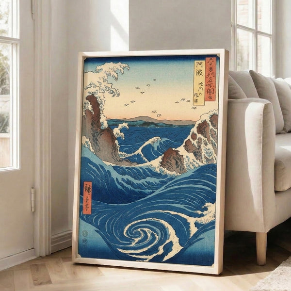 Contemplative ocean wall art print showing a monumental whirlpool in shades of blue, surrounded by rocky cliffs and silhouetted birds, inspired by classical Japanese woodblock aesthetics.