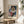 Minimalist poster art depicting a weary dancer perched on a stool, rendered in simple expressive lines with warm and cool neutral tones.
