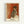Vintage-style art print depicting a faceless female dancer in classical ballet position, rendered in warm earth tones with impressionistic brushwork.