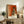 Contemplative dance-themed wall art in the style of classical impressionism, depicting a crossed-arm pose in warm, earthy tones.