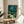 Framed vintage-style artwork depicting a tranquil pond at night with fireflies, bamboo stalks, and reeds rendered in calming teals, golds, and forest greens.