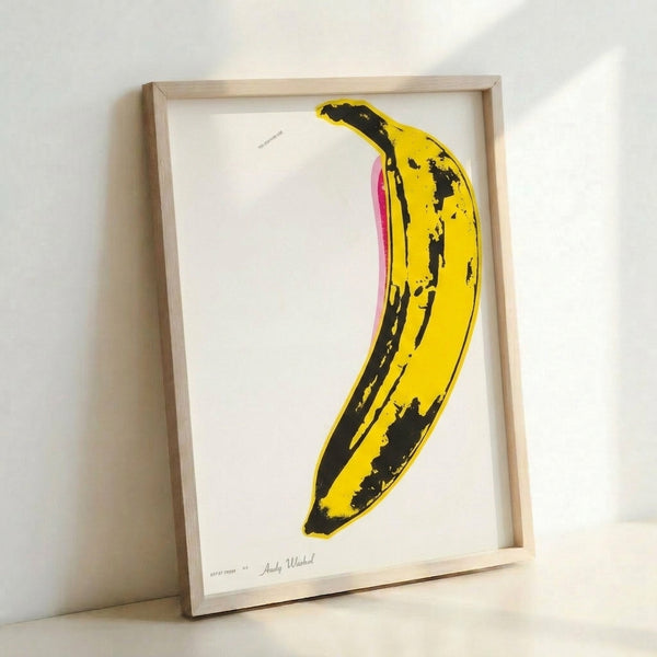 Eye-catching banana artwork in vivid yellow with graphic pop art treatment, displayed as a framed poster reflecting bold contemporary design.
