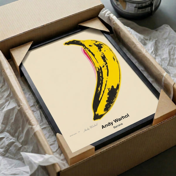 Iconic pop art style banana poster featuring bold yellows and black graphic elements, framed modern artwork with graphic sensibility.