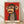 Pop art poster of a monkey clinging to a branch with an exhausted, sarcastic expression in bold red, tan, and black tones.