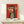 Funky retro-inspired wall art showing a monkey gripping a branch with comedic desperation, executed in striking red and neutral tones.