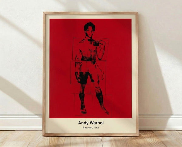 Bold pop art portrait with abstracted face in black, white, and vibrant accent colors, framed on wall as contemporary art print.