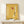 Constructivist wall art with foundational geometric composition in minimalist colors: yellow, red, cream, black, and blue tones on a framed poster.
