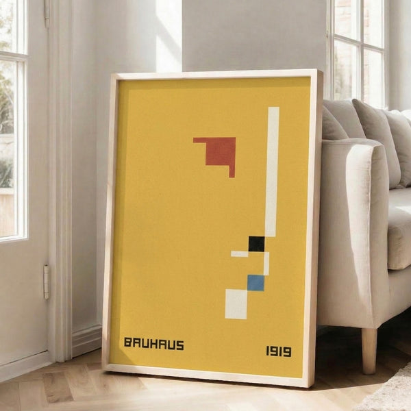 Modern abstract poster featuring bold Bauhaus-inspired geometric forms arranged in cream, golden yellow, terracotta red, steel blue, and black.
