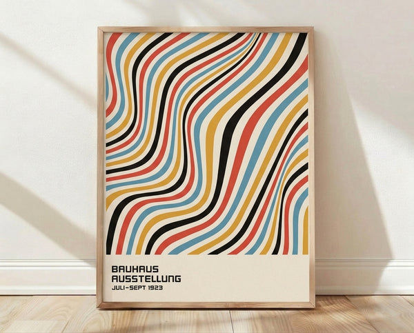 Framed Bauhaus 1923 exhibition poster featuring bold red, steel blue, and golden yellow stripes in a rhythmic wave pattern against cream background.