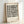 Contemporary geometric poster showcasing contemplative Bauhaus design with cream background and charcoal circular and rectangular forms.