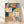 Bauhaus patchwork grid print featuring abstract geometric shapes, curves, and color blocks in navy blue, burnt orange, cream, terracotta, and mustard gold on a framed poster.