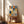 Abstract Bauhaus grid design combining geometric shapes and curved lines in a constructive arrangement of navy, terracotta, cream, and gold hues as a framed print.