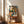 Vibrant jazz-themed wall art in Bauhaus aesthetic with abstract representations of musical instruments—trumpet, mic, and piano—composed of bold geometric shapes in gold, teal, and cream.