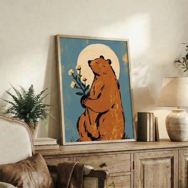 Whimsical cottagecore art print of a contemplative bear cradling delicate flowers under a luminous moon in a muted palette of teal and rust on cream.