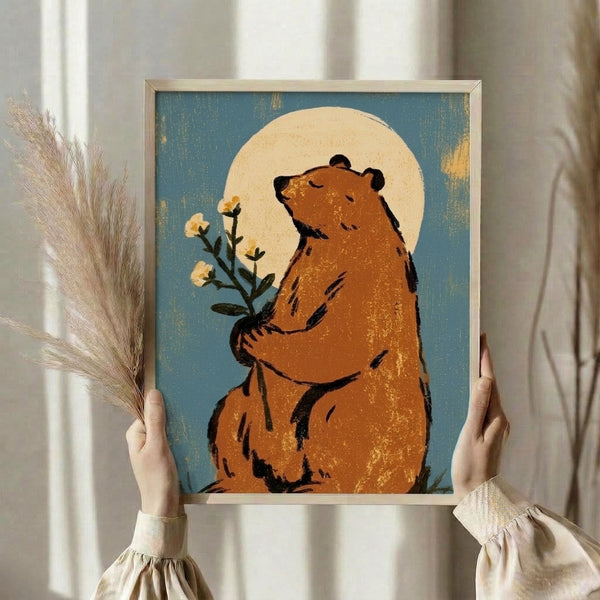 Dreamy poster showing a peaceful bear holding flowers against a full moon backdrop, blending cottagecore charm with retro minimalist design in teal, brown, and gold.