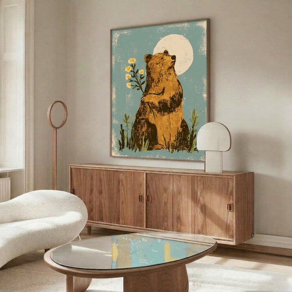 Gentle bear surrounded by wildflowers under a luminous moon in a soft palette of teal, cream, olive, and gold; bohemian folk-inspired poster print with a quiet, contemplative charm.
