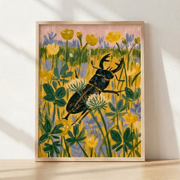 Watercolor art print of a stag beetle surrounded by wildflowers in soft yellows, greens, dusty rose, and periwinkle blue tones, framed on a wall.