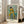 Vintage-inspired framed poster of a solitary dancer in pale yellow, examining her appearance with gentle introspection in a refined, warmly-lit studio setting.