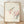 Serene watercolor painting of a bird perched on a cherry blossom branch, rendered in soft pink, cream, and pale green tones with minimalist Japanese aesthetic.