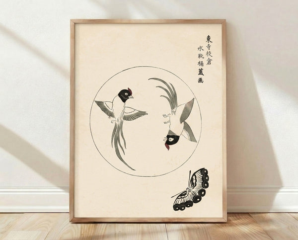 Framed Japanese woodblock poster depicting circling birds and a monarch butterfly among delicate grass in cream, black, and pale green tones, evoking serene naturalistic observation.