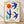 Abstract cut-out poster in cobalt blue, crimson red, and chartreuse green depicting stylized birds and organic shapes, framed on a wall.