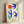 Framed abstract poster with bold geometric bird silhouettes in cobalt, red, and lime green against a contemplative white background.