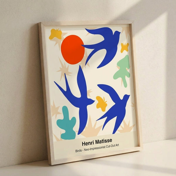 Framed abstract poster with bold geometric bird silhouettes in cobalt, red, and lime green against a contemplative white background.