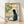 Serene black cat sitting by a bamboo window in minimalist sumi-e style, rendered in cream, sage green, and soft gray tones on a framed art print.