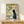 Japanese-inspired framed poster depicting a contemplative cat gazing past bamboo in muted earth tones with zen calligraphy aesthetics.