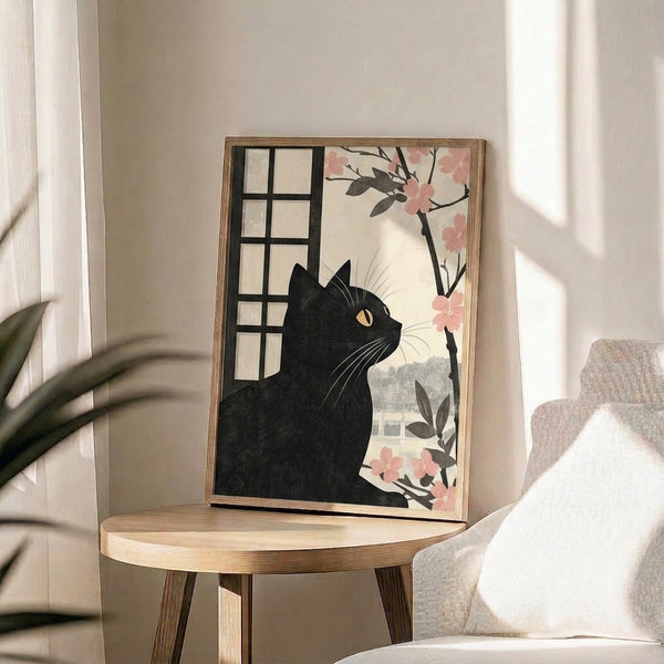 Contemplative framed poster in Japanese woodblock aesthetic showing a black cat amid cherry blossom imagery in cream, pink, and charcoal gray tones.