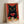 Pop art poster showing a glamorous black cat paired with a cocktail composition featuring pomegranate, cranberry, and botanical elements in rich terracotta and black.