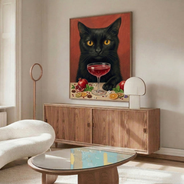 Vintage-inspired art print featuring a stylized black cat beside a pomegranate-adorned cocktail in retro pop art style, rendered in deep reds, blacks, and cream hues.