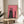 Abstract black cat creature rendered in modern line art style with striking red pattern overlays and white accents, unsettling yet captivating wall poster.