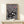 Abstract minimalist poster of a black cat surrounded by red and white eye patterns, blending whimsy with an unsettling artistic vision.