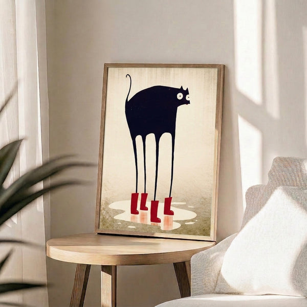 Contemporary minimalist art print of a quirky black cat in red rain boots by a puddle, featuring clean line work and a soothing cream and taupe color scheme.